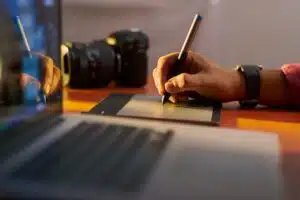 Artist Photographer Retouches Photo On Computer Graphic Tablet